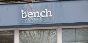 Bench Outreach sign on the front of the building