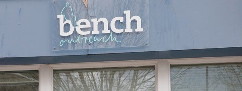 Bench Outreach sign on the front of the building